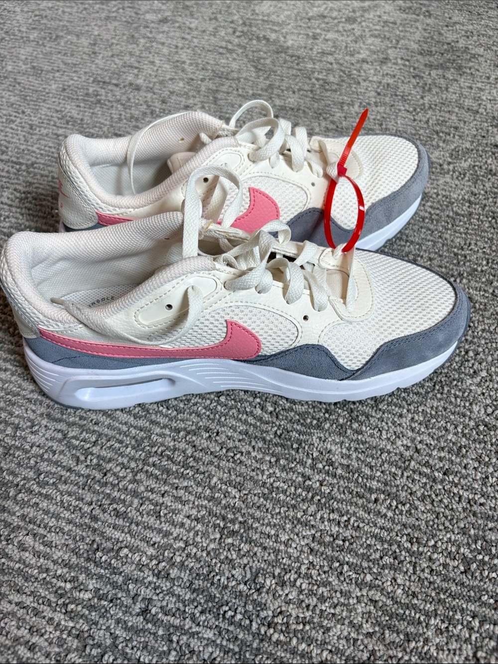 Nike Women’s White Sneakers with Pink Swoosh and Gray Accents